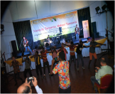 Alobo Naga and the band singing with the university Students